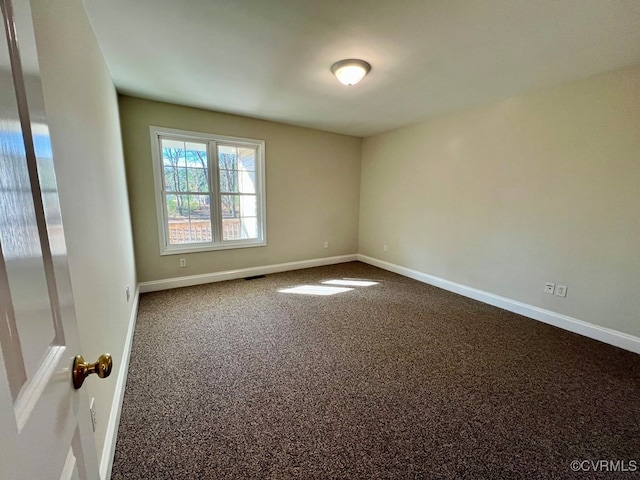 spare room with carpet floors