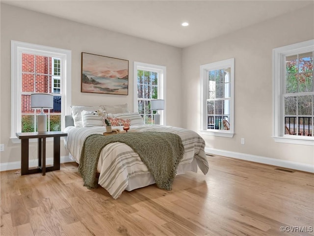 bedroom with light hardwood / wood-style flooring