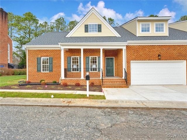 view of front of house with a garage and covered porch