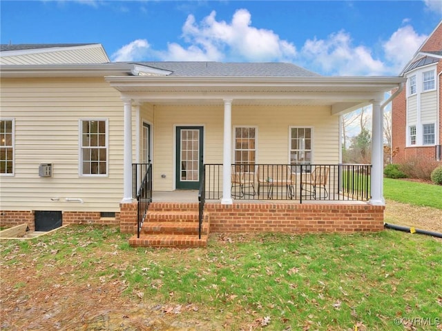 exterior space with a porch and a front lawn