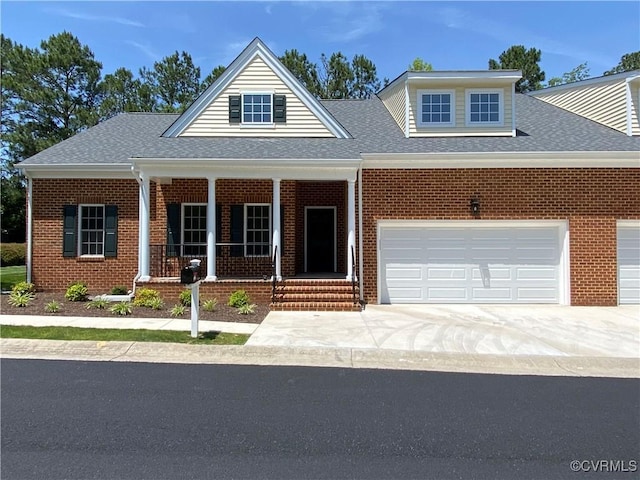 30305 Victoria Way, Petersburg, VA 23805 - view of front facade featuring brick siding, a porch, concrete driveway, and an attached garage