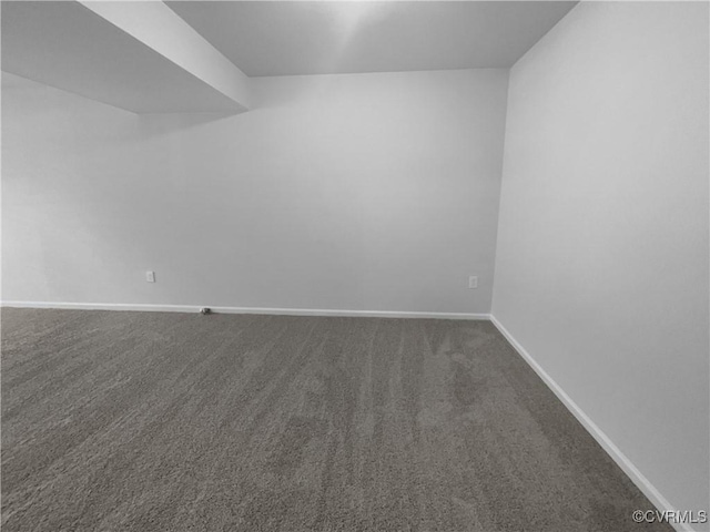 spare room featuring carpet floors