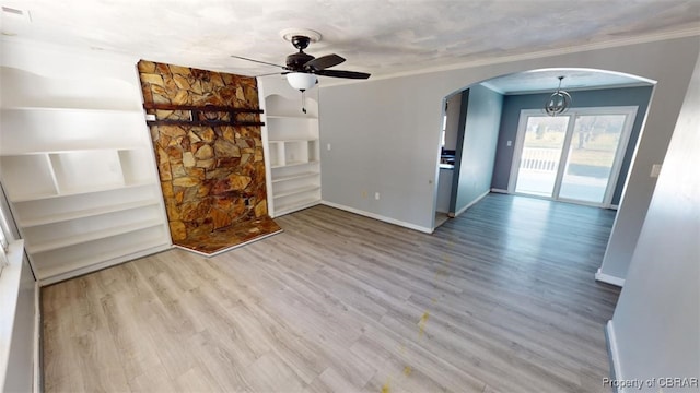 unfurnished living room with ceiling fan, crown molding, and light hardwood / wood-style flooring