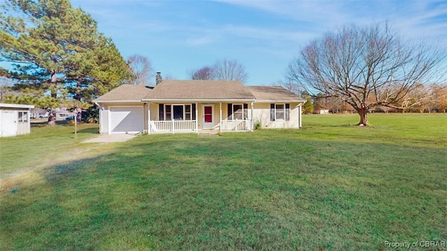 ranch-style house with covered porch, a garage, and a front lawn