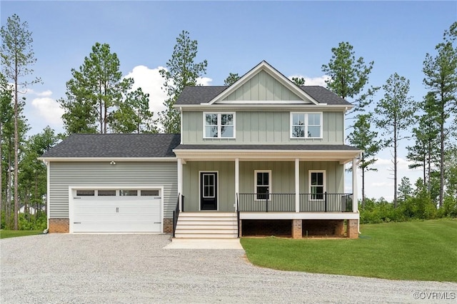 craftsman-style home with a front yard, a porch, and a garage