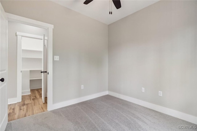 unfurnished room featuring light colored carpet and ceiling fan