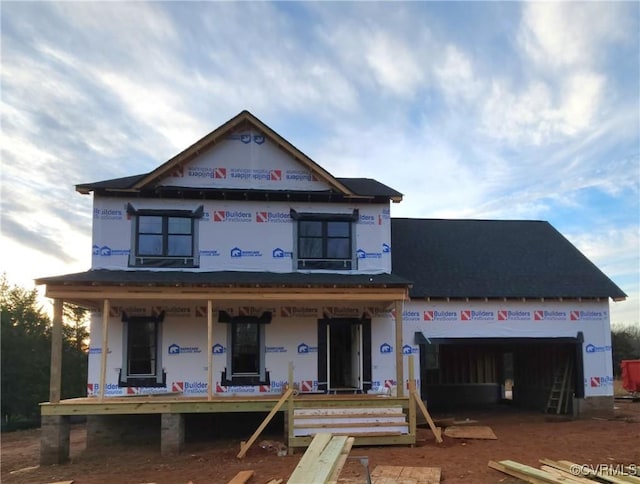 property under construction featuring covered porch