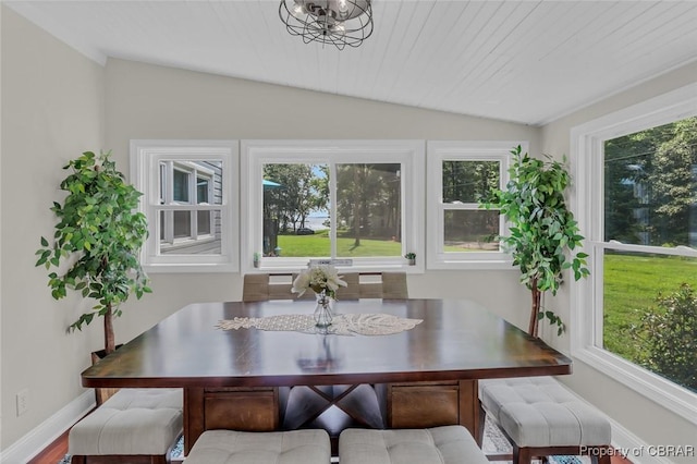 sunroom with a chandelier, a healthy amount of sunlight, and lofted ceiling