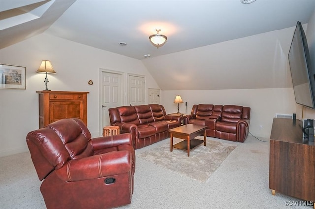 living room featuring lofted ceiling