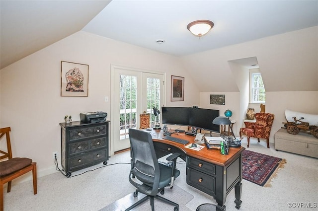 home office with light carpet, baseboards, and vaulted ceiling