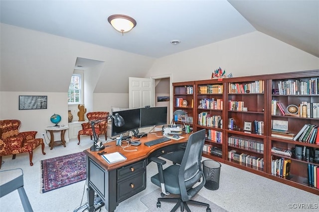 office space with lofted ceiling and carpet floors