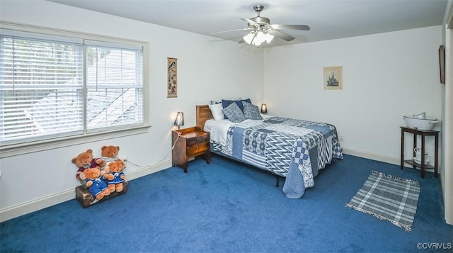 bedroom featuring a ceiling fan, baseboards, and carpet floors