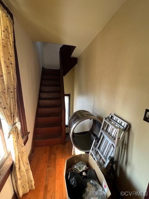 staircase with wood finished floors