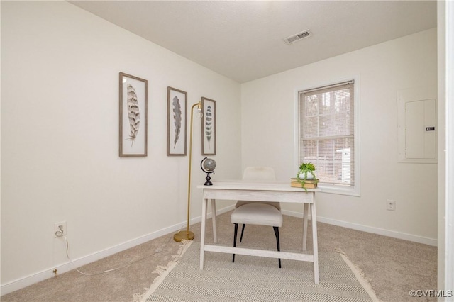 office area with light carpet and electric panel