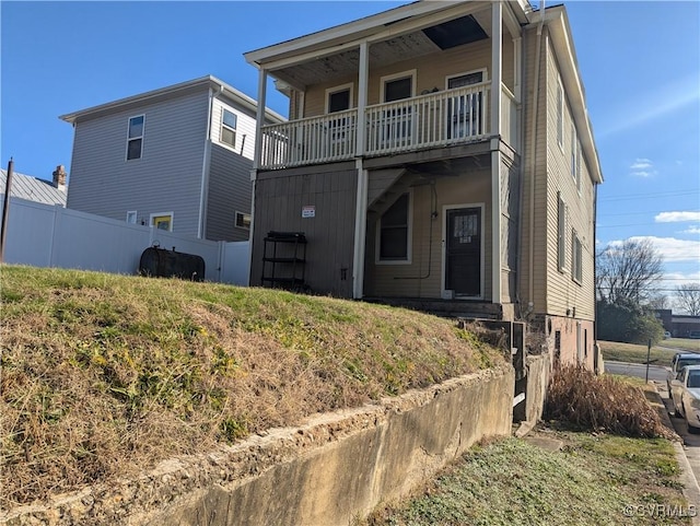 view of front of property with a balcony