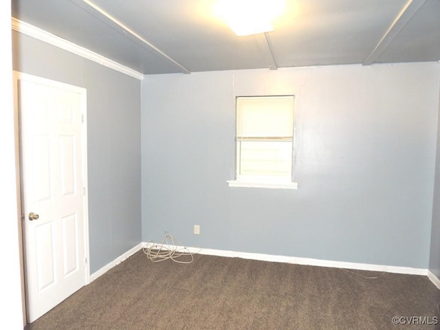 carpeted spare room with baseboards