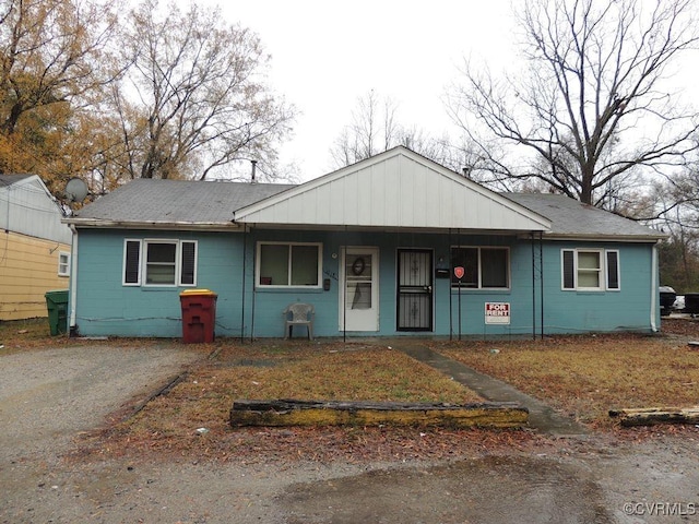 view of front of home featuring a porch and a shingled roof