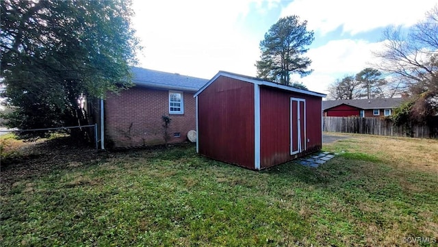 view of shed with fence