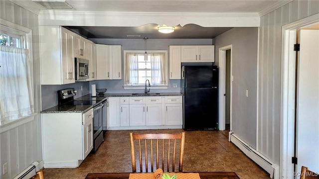 kitchen with visible vents, stainless steel appliances, a baseboard heating unit, and a sink