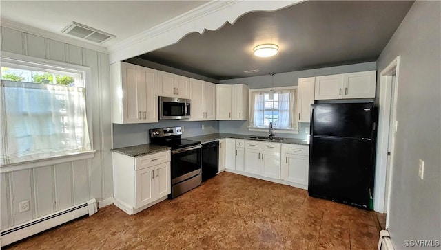 kitchen with visible vents, black appliances, a baseboard heating unit, white cabinetry, and a sink