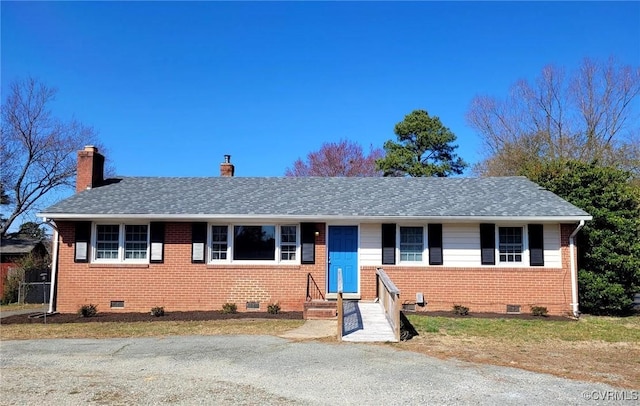 ranch-style house with a chimney, brick siding, and crawl space