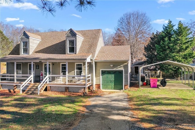 view of front of house featuring a carport, a garage, covered porch, and a front lawn