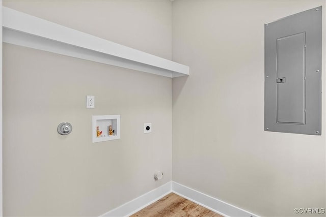 laundry area with gas dryer hookup, light hardwood / wood-style flooring, electric dryer hookup, electric panel, and washer hookup