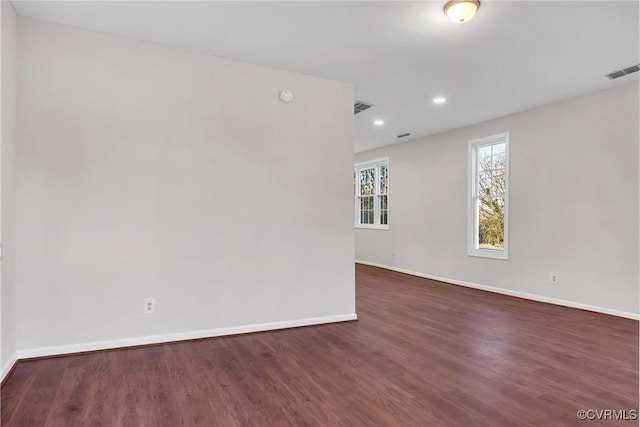 empty room with dark wood-type flooring