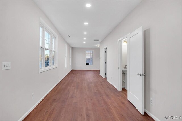 hall with wood-type flooring