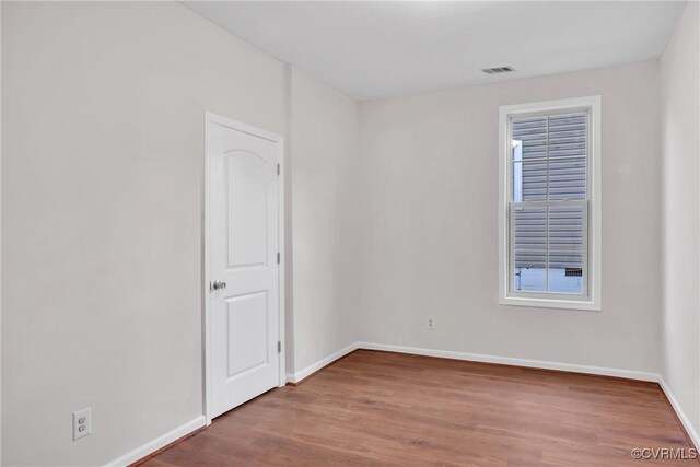 empty room featuring hardwood / wood-style floors