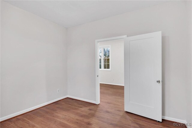 spare room featuring hardwood / wood-style floors