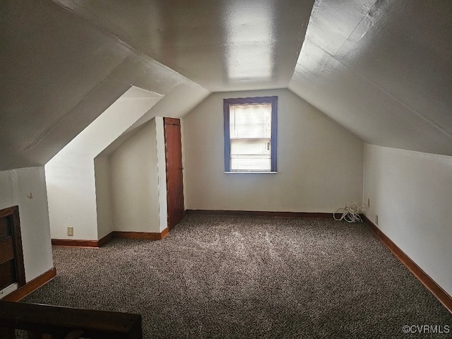 bonus room featuring carpet and vaulted ceiling