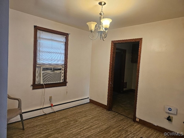 empty room with dark hardwood / wood-style flooring, cooling unit, a baseboard radiator, and a notable chandelier