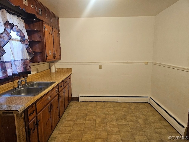 kitchen with a baseboard radiator and sink