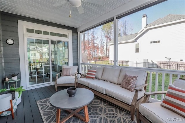 sunroom / solarium with a wealth of natural light and ceiling fan