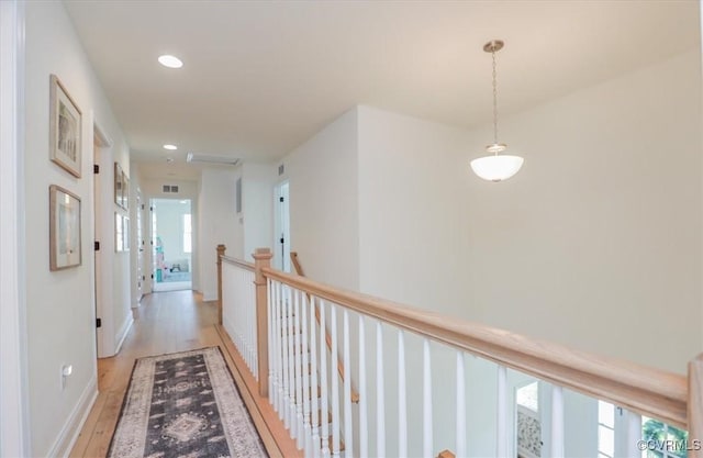 corridor featuring light hardwood / wood-style floors