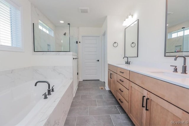 bathroom with vanity, shower with separate bathtub, and tile patterned floors