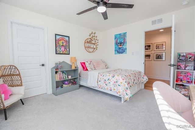 carpeted bedroom with ceiling fan