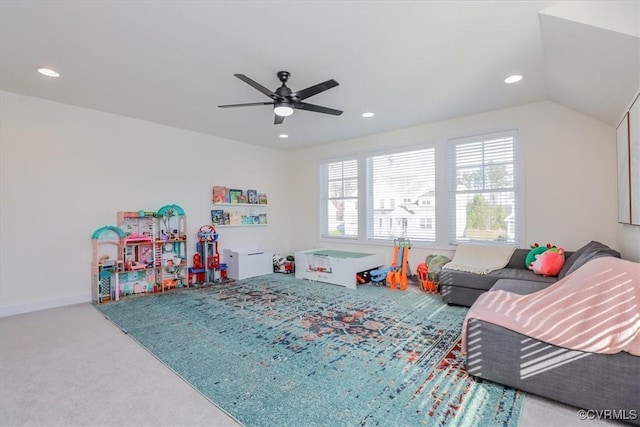 game room with vaulted ceiling, ceiling fan, and carpet flooring