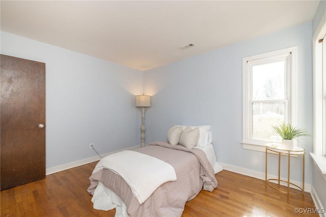 bedroom featuring hardwood / wood-style flooring