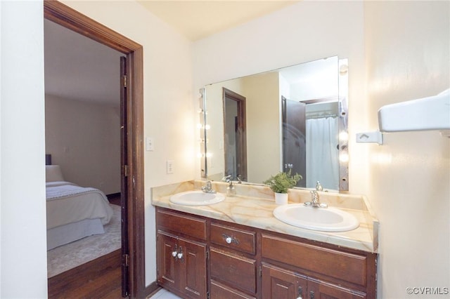 bathroom featuring hardwood / wood-style flooring and vanity