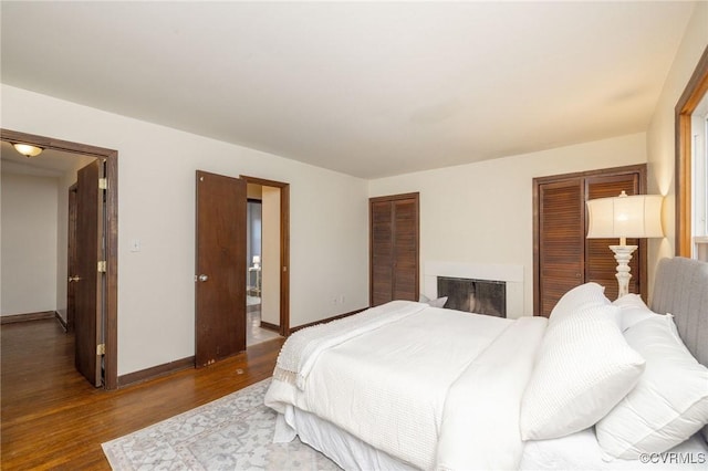 bedroom featuring hardwood / wood-style floors and a closet