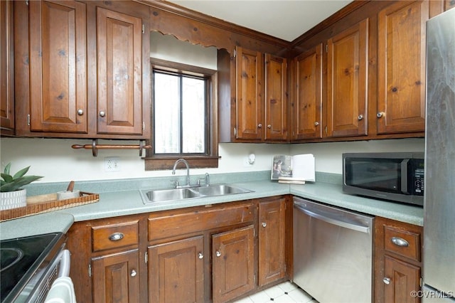 kitchen with sink and appliances with stainless steel finishes