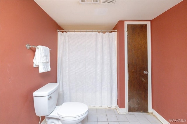 bathroom featuring tile patterned floors and toilet