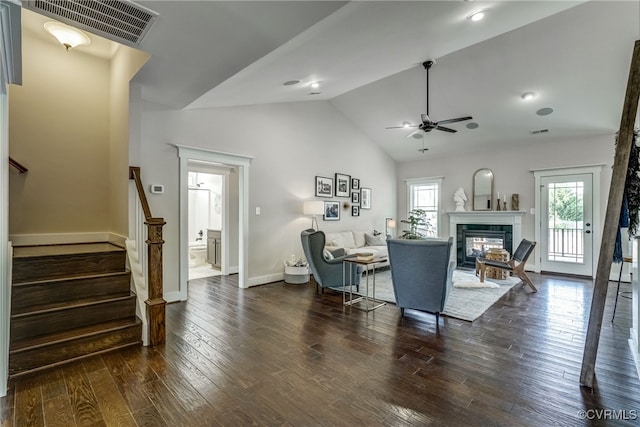 living room with ceiling fan, dark wood-type flooring, and high vaulted ceiling