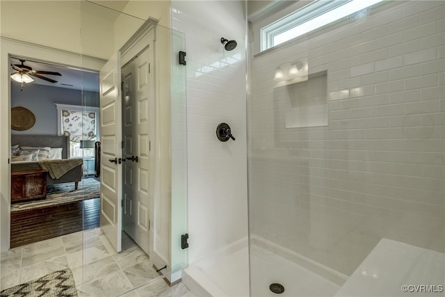 bathroom with ceiling fan, hardwood / wood-style floors, and a shower with door