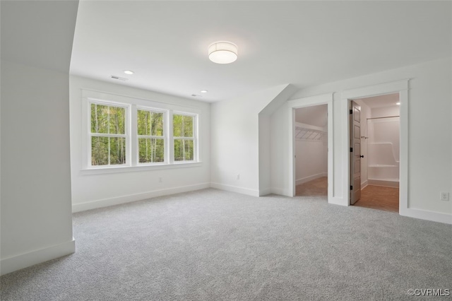 2219 Silver St, Aylett, VA 23009 - unfurnished bedroom with carpet flooring, a spacious closet, recessed lighting, and ensuite bath