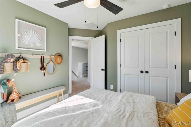 bedroom featuring ceiling fan, a closet, and carpet