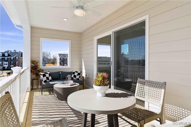 balcony featuring outdoor lounge area and a ceiling fan