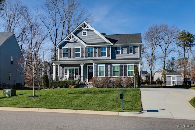 view of front of house with a porch and a front lawn